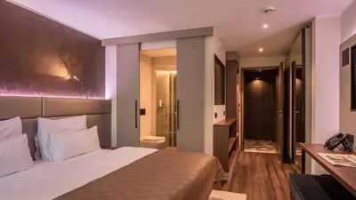Ein Bett oder Betten in einem Zimmer der Unterkunft Innspire Hotel