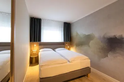 Ein Bett oder Betten in einem Zimmer der Unterkunft The Rilano Munich, Trademark Collection by Wyndham