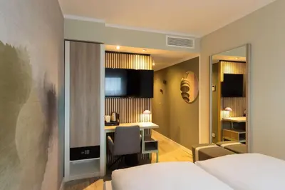 Ein Bett oder Betten in einem Zimmer der Unterkunft The Rilano Munich, Trademark Collection by Wyndham