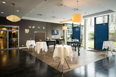 Ein Restaurant oder anderes Speiselokal in der Unterkunft The Rilano Munich, Trademark Collection by Wyndham
