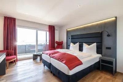 Ein Bett oder Betten in einem Zimmer der Unterkunft Augsburg Hotel Sonnenhof