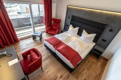 Ein Bett oder Betten in einem Zimmer der Unterkunft Augsburg Hotel Sonnenhof