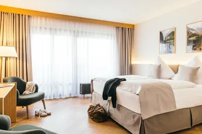 Ein Bett oder Betten in einem Zimmer der Unterkunft Garden Hotel Reinhart