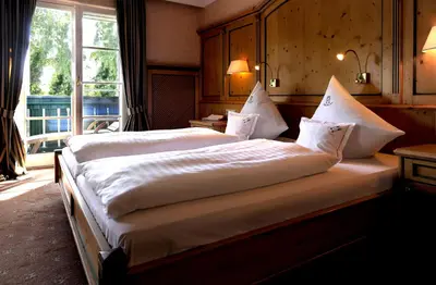 Ein Bett oder Betten in einem Zimmer der Unterkunft Garden Hotel Reinhart