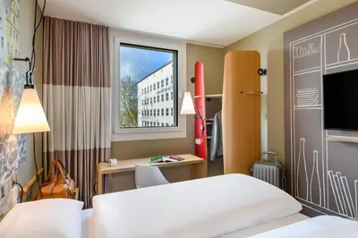Ein Bett oder Betten in einem Zimmer der Unterkunft ibis Landshut City