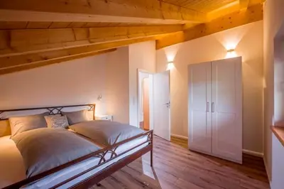 Ein Bett oder Betten in einem Zimmer der Unterkunft Ferienwohnung Hofmann