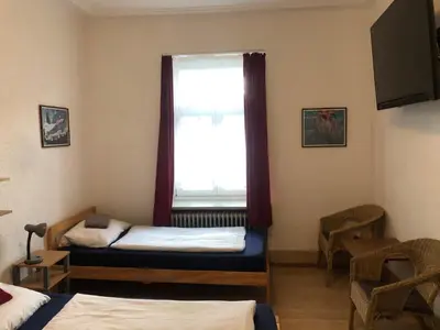 Ein Bett oder Betten in einem Zimmer der Unterkunft Hotel Pension Schmellergarten
