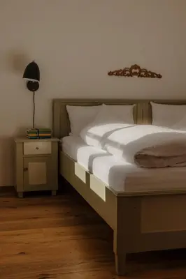 Ein Bett oder Betten in einem Zimmer der Unterkunft Staudingerhof