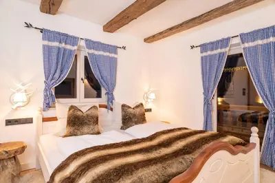 Ein Bett oder Betten in einem Zimmer der Unterkunft exklusives Alpenchalet mit Jacuzzi & Sauna für bis zu 10 Personen