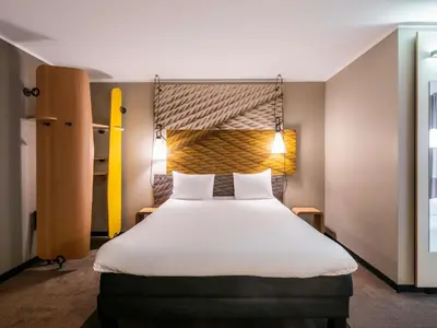 Ein Bett oder Betten in einem Zimmer der Unterkunft ibis Hotel München City
