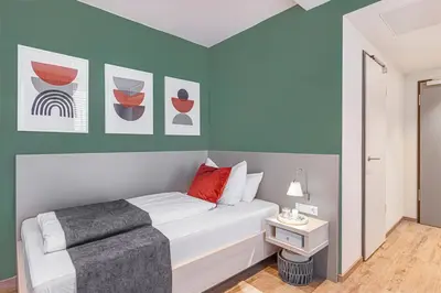 Ein Bett oder Betten in einem Zimmer der Unterkunft Vonder Munich