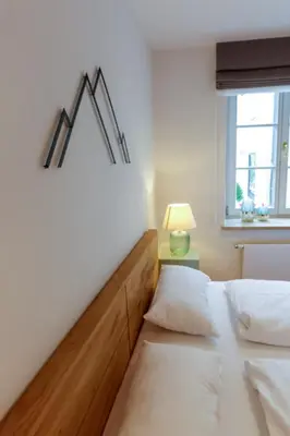 Ein Bett oder Betten in einem Zimmer der Unterkunft Bad Tölz Mittendrin