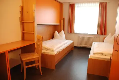 Ein Bett oder Betten in einem Zimmer der Unterkunft Ausbildungshotel St. Theresia