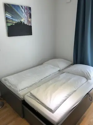 Ein Bett oder Betten in einem Zimmer der Unterkunft My room serviced apartment-Messe