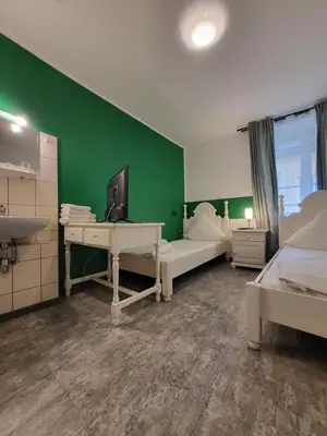 Ein Bett oder Betten in einem Zimmer der Unterkunft Hotel Atlanta