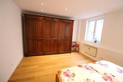 Ein Bett oder Betten in einem Zimmer der Unterkunft Fewo am Josephsplatz 125 m2
