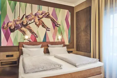 Ein Bett oder Betten in einem Zimmer der Unterkunft Hotel Starnberger See