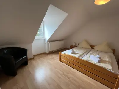 Ein Bett oder Betten in einem Zimmer der Unterkunft Alter Wirt Thalkirchen