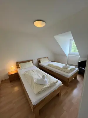 Ein Bett oder Betten in einem Zimmer der Unterkunft Alter Wirt Thalkirchen