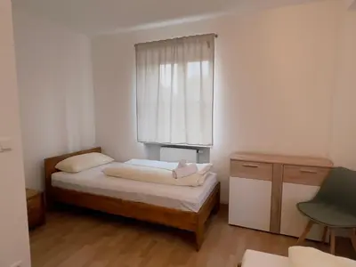 Ein Bett oder Betten in einem Zimmer der Unterkunft Alter Wirt Thalkirchen