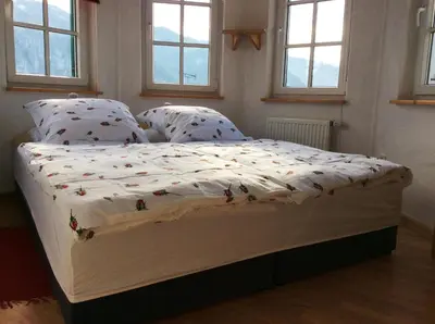 Ein Bett oder Betten in einem Zimmer der Unterkunft Ferienwohnung Rosenlehner
