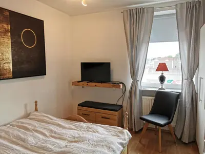 Ein Bett oder Betten in einem Zimmer der Unterkunft Bahnhof City Loft & Apartments