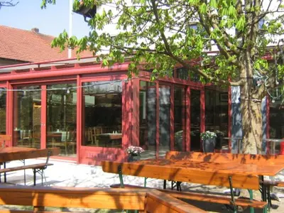 Ein Restaurant oder anderes Speiselokal in der Unterkunft Gasthof Bogenrieder