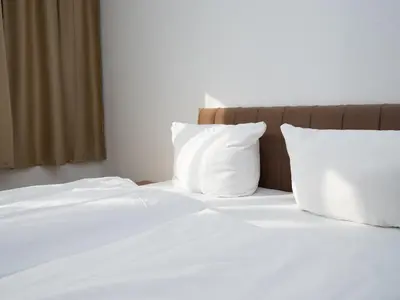 Ein Bett oder Betten in einem Zimmer der Unterkunft DONAUHOTEL Ingolstadt