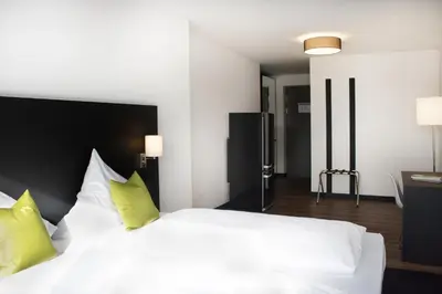 Ein Bett oder Betten in einem Zimmer der Unterkunft ING Hotel by WMM Hotels