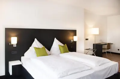 Ein Bett oder Betten in einem Zimmer der Unterkunft ING Hotel by WMM Hotels