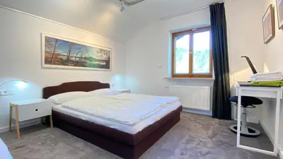 Ein Bett oder Betten in einem Zimmer der Unterkunft Pure Nature Munich - Alps