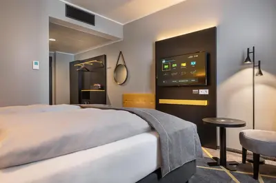 Ein Bett oder Betten in einem Zimmer der Unterkunft Holiday Inn - the niu, Fury Aschheim Messe by IHG