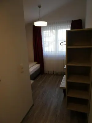 Ein Bett oder Betten in einem Zimmer der Unterkunft Gästehaus Stahuber