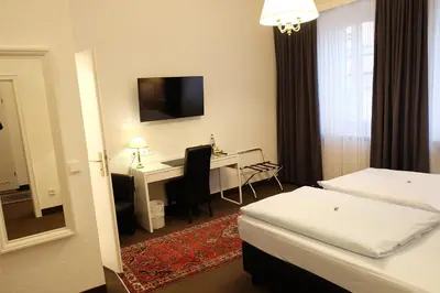 Ein Bett oder Betten in einem Zimmer der Unterkunft Hotel Adler