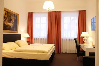 Ein Bett oder Betten in einem Zimmer der Unterkunft Hotel Adler