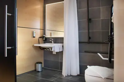 Ein Badezimmer in der Unterkunft KF Hotel by WMM Hotels