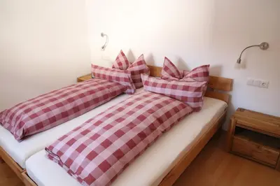 Ein Bett oder Betten in einem Zimmer der Unterkunft Alpen - Apartments II