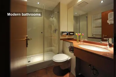 Ein Badezimmer in der Unterkunft Ambassador Parkhotel