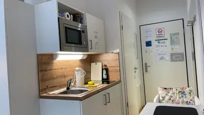 Küche/Küchenzeile in der Unterkunft Myroom Business Apartment Nähe Messe München