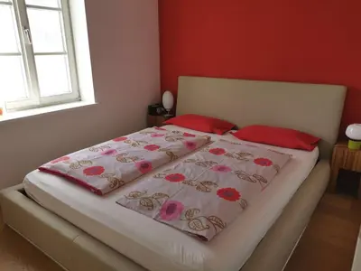 Ein Bett oder Betten in einem Zimmer der Unterkunft Ferienwohnung Dausacker