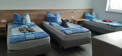 Ein Bett oder Betten in einem Zimmer der Unterkunft Pension Assmann