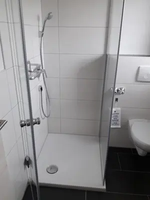 Ein Badezimmer in der Unterkunft Pension Assmann