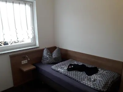 Ein Bett oder Betten in einem Zimmer der Unterkunft Pension Assmann