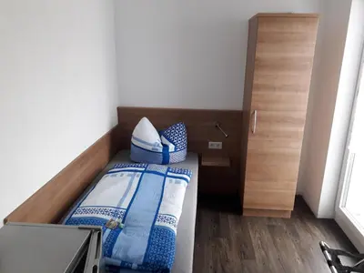 Ein Bett oder Betten in einem Zimmer der Unterkunft Pension Assmann