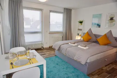 Ein Bett oder Betten in einem Zimmer der Unterkunft MH Apartment
