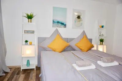 Ein Bett oder Betten in einem Zimmer der Unterkunft MH Apartment