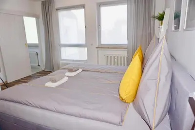 Ein Bett oder Betten in einem Zimmer der Unterkunft MH Apartment