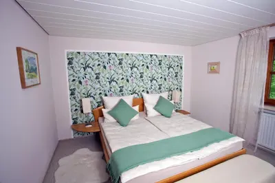 Ein Bett oder Betten in einem Zimmer der Unterkunft Ferienwohnung Deubzer in Palling
