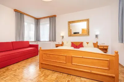 Ein Bett oder Betten in einem Zimmer der Unterkunft Gästehaus Kochelsee