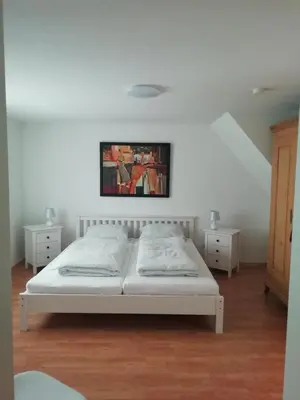 Ein Bett oder Betten in einem Zimmer der Unterkunft Stadthaus Kaufbeuren